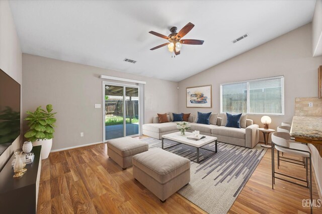 11602 Trabancos Dr, Bakersfield, CA 93311 - living area with lofted ceiling, a ceiling fan, and light wood-style flooring
