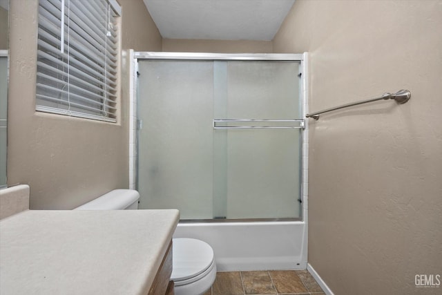 11602 Trabancos Dr, Bakersfield, CA 93311 - full bath with vanity, combined bath / shower with glass door, and stone finish flooring