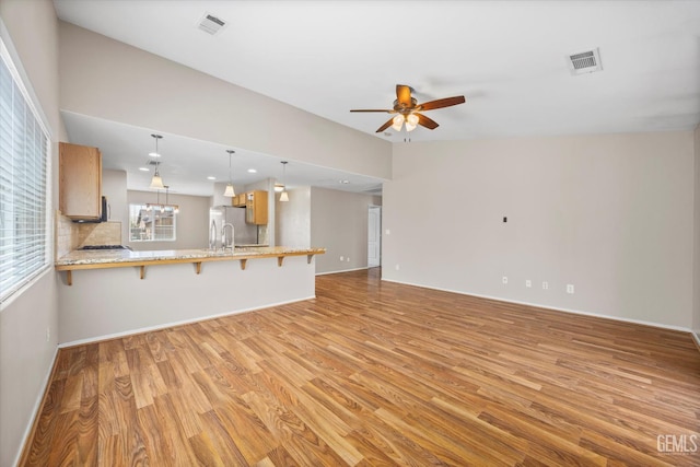 11602 Trabancos Dr, Bakersfield, CA 93311 - unfurnished living room featuring light wood finished floors, a ceiling fan, and recessed lighting
