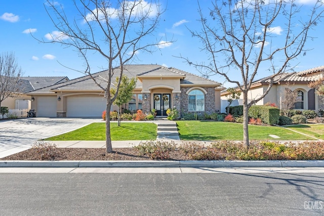 view of front of home with a garage and a front yard