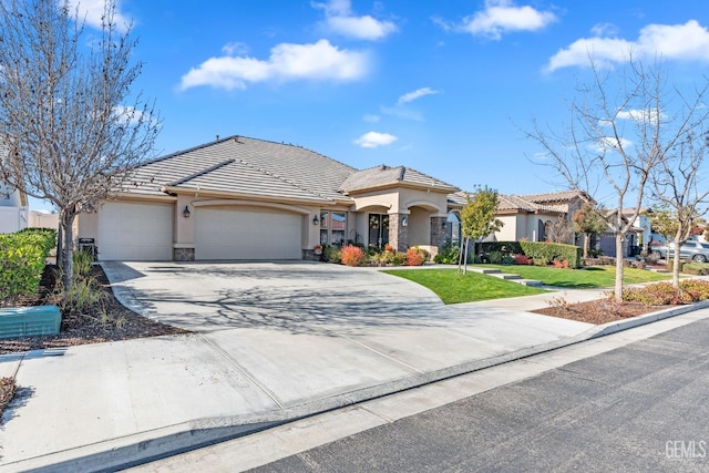 view of front facade with a garage and a front lawn