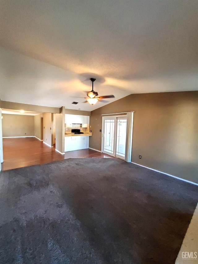 4204 Tyndall Ave, Bakersfield, CA 93313 - unfurnished living room featuring dark carpet, a ceiling fan, and lofted ceiling