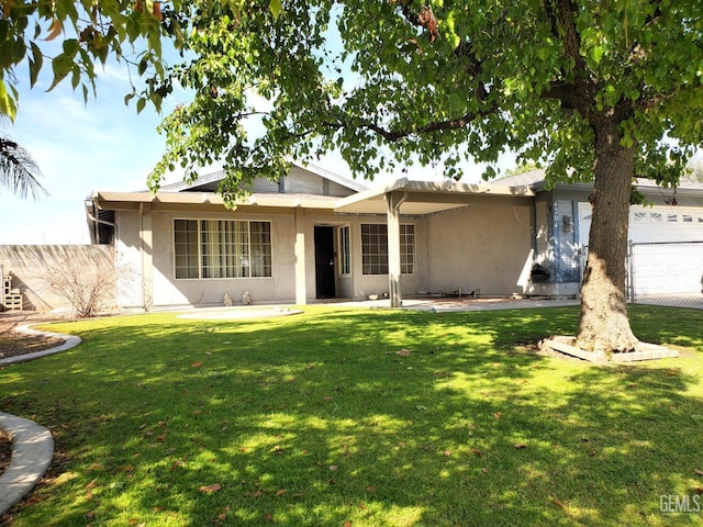 4204 Tyndall Ave, Bakersfield, CA 93313 - view of front of home with stucco siding and an attached garage