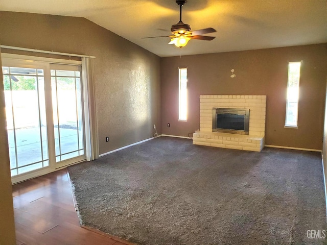 4204 Tyndall Ave, Bakersfield, CA 93313 - unfurnished living room with healthy amount of natural light, vaulted ceiling, a brick fireplace, and a ceiling fan