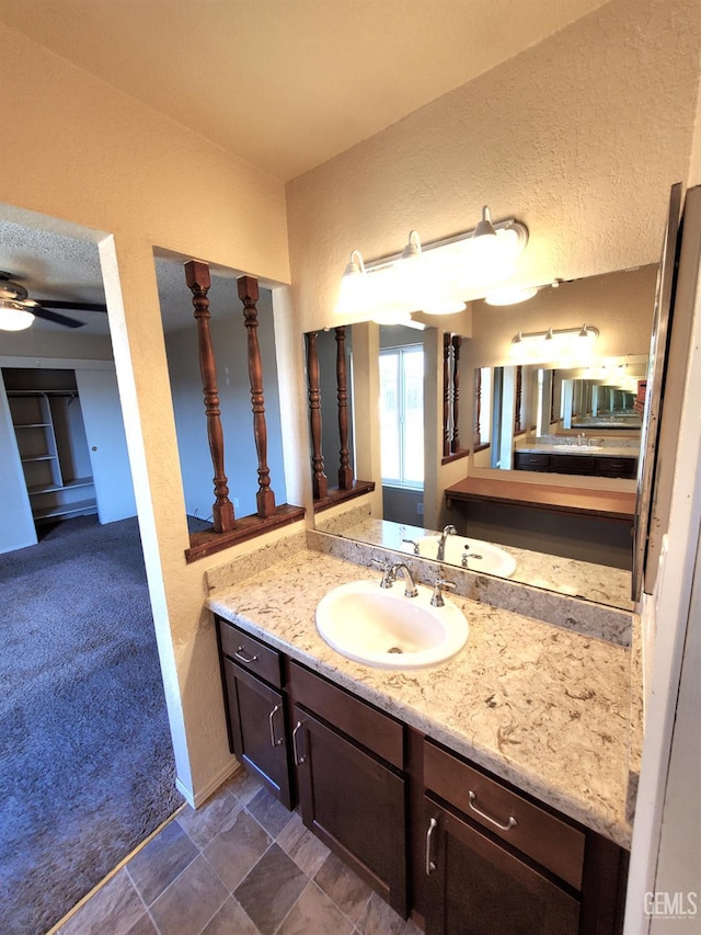 4204 Tyndall Ave, Bakersfield, CA 93313 - bathroom with a textured wall, vanity, and ceiling fan