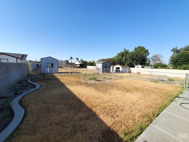 4204 Tyndall Ave, Bakersfield, CA 93313 - view of yard featuring a storage unit