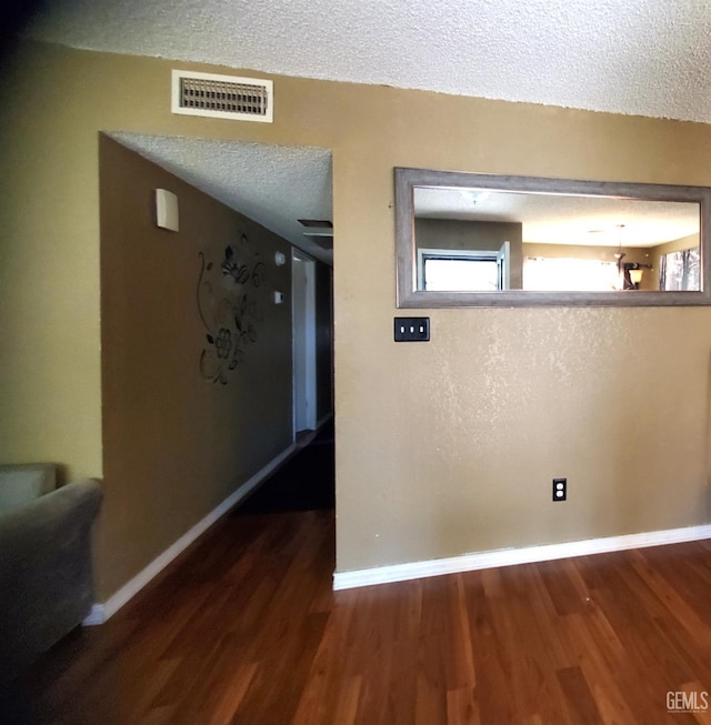 4204 Tyndall Ave, Bakersfield, CA 93313 - corridor featuring wood finished floors and a textured ceiling