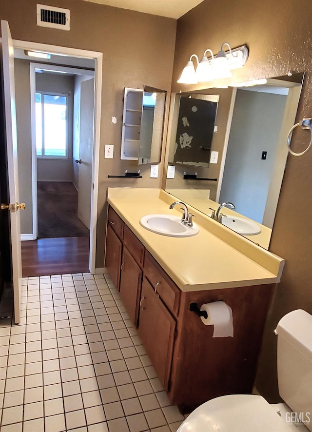 4204 Tyndall Ave, Bakersfield, CA 93313 - half bathroom with tile patterned flooring and vanity