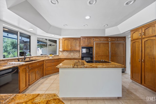 11717 Old Town Rd, Bakersfield, CA 93312 - kitchen featuring black appliances, stone counters, light tile patterned flooring, a kitchen island, and recessed lighting