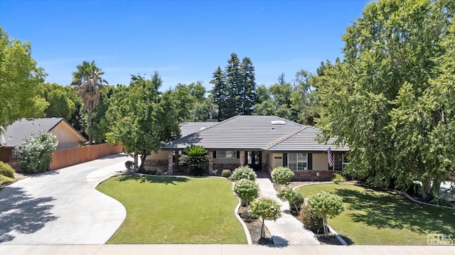 11717 Old Town Rd, Bakersfield, CA 93312 - single story home with driveway, a tiled roof, and stone siding