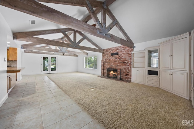 11717 Old Town Rd, Bakersfield, CA 93312 - unfurnished living room with light tile patterned flooring, light carpet, a brick fireplace, and french doors