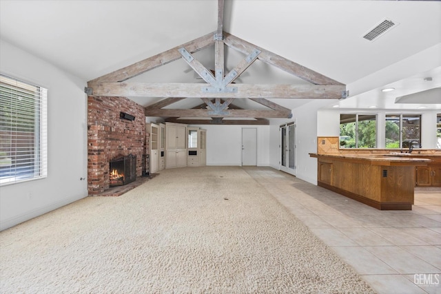 11717 Old Town Rd, Bakersfield, CA 93312 - unfurnished living room with high vaulted ceiling, a fireplace, beam ceiling, healthy amount of natural light, and light tile patterned flooring