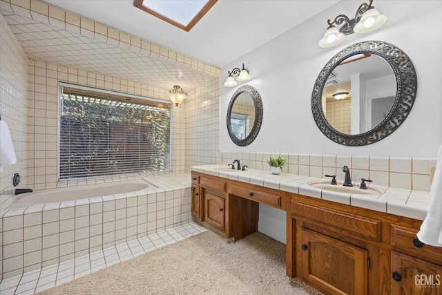 11717 Old Town Rd, Bakersfield, CA 93312 - full bathroom with double vanity, a garden tub, backsplash, and tile walls