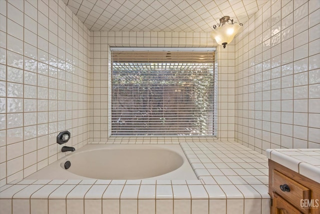 11717 Old Town Rd, Bakersfield, CA 93312 - full bathroom featuring a bath, tile walls, and vanity