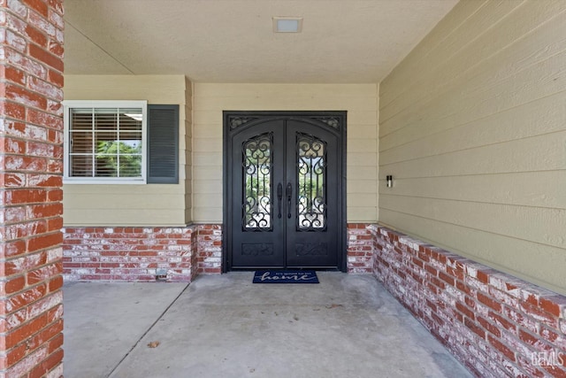 11717 Old Town Rd, Bakersfield, CA 93312 - doorway to property featuring french doors and brick siding