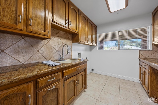 11717 Old Town Rd, Bakersfield, CA 93312 - kitchen featuring brown cabinets, tasteful backsplash, and light tile patterned floors