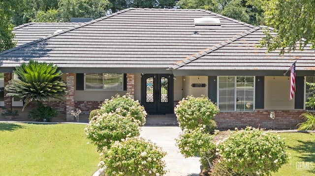 11717 Old Town Rd, Bakersfield, CA 93312 - view of front of property featuring brick siding, french doors, and a tiled roof