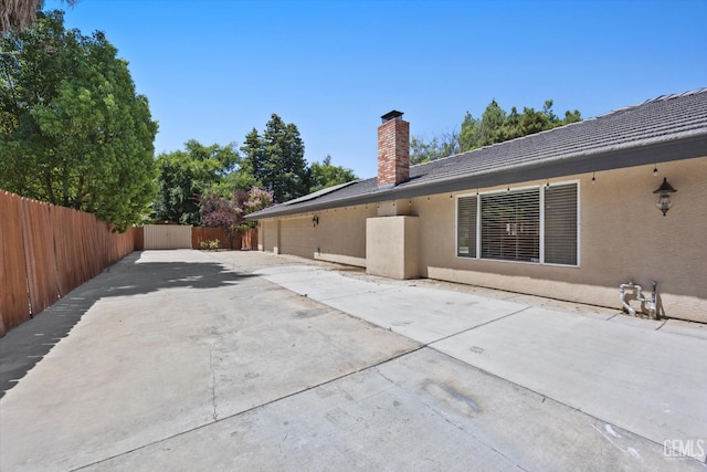 11717 Old Town Rd, Bakersfield, CA 93312 - view of patio with a garage and driveway