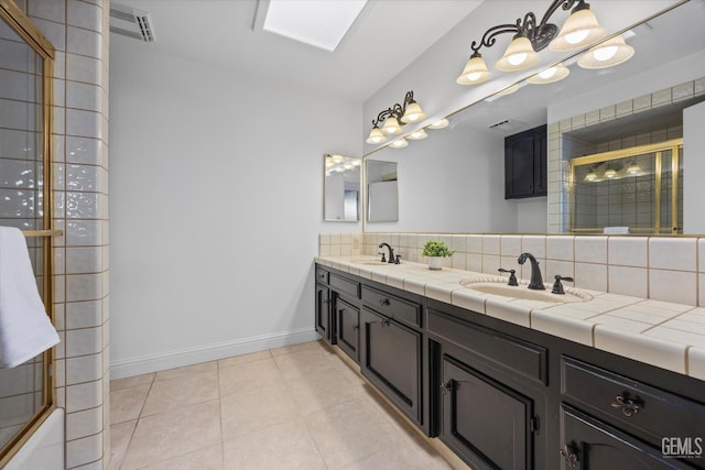 11717 Old Town Rd, Bakersfield, CA 93312 - bathroom featuring backsplash, double vanity, and tile patterned flooring