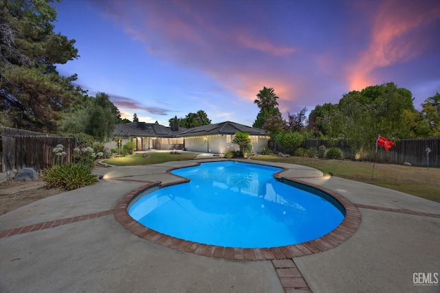11717 Old Town Rd, Bakersfield, CA 93312 - pool at dusk with a fenced backyard and a patio area