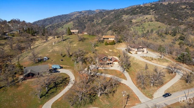 birds eye view of property with a mountain view