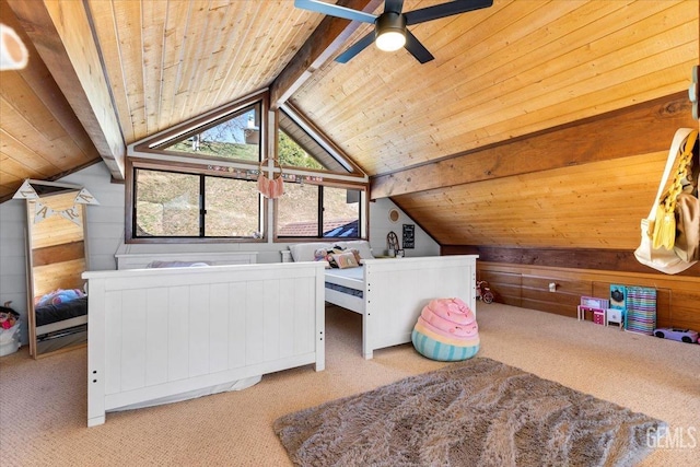 bedroom with lofted ceiling with beams, wood walls, wooden ceiling, and carpet