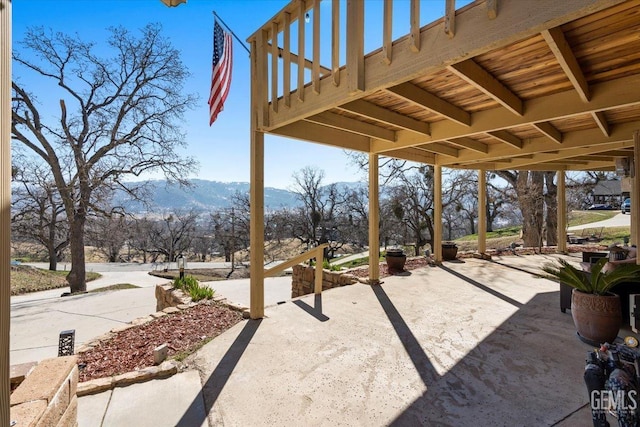 view of patio / terrace featuring a mountain view