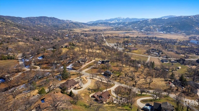 drone / aerial view featuring a mountain view