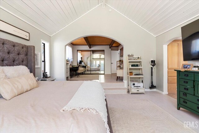 bedroom with vaulted ceiling with beams, wooden ceiling, arched walkways, and ornamental molding