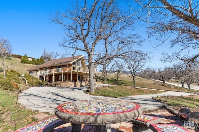 back of property featuring a wooden deck