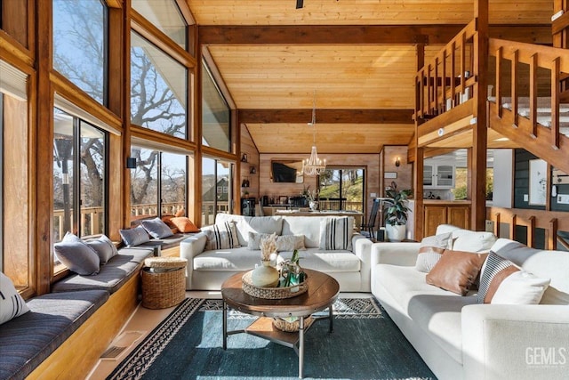 sunroom / solarium featuring a chandelier, wooden ceiling, and vaulted ceiling with beams