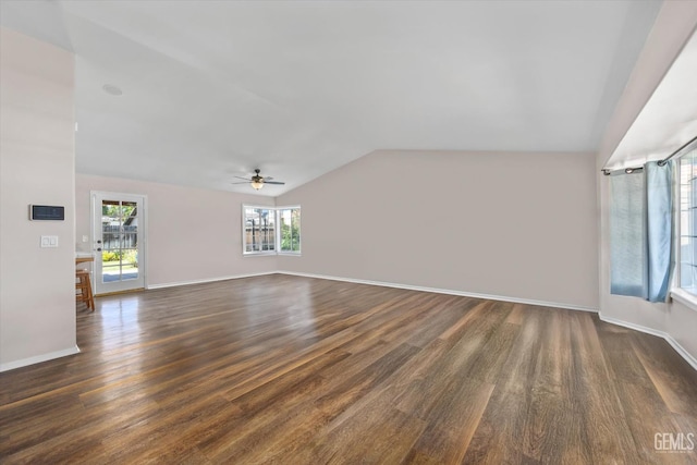 9913 Mark Twain Ave, Bakersfield, CA 93312 - unfurnished living room featuring lofted ceiling, dark wood-style floors, and ceiling fan