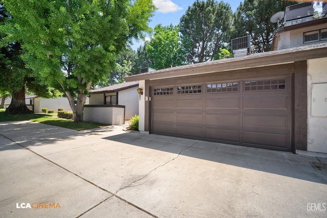 garage featuring driveway