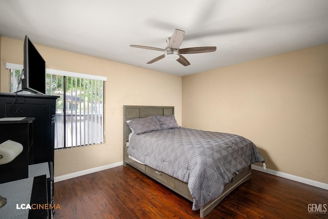 bedroom with ceiling fan, wood-type flooring, and baseboards