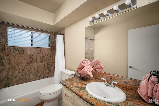 full bath featuring shower / bath combo with shower curtain, toilet, and vanity