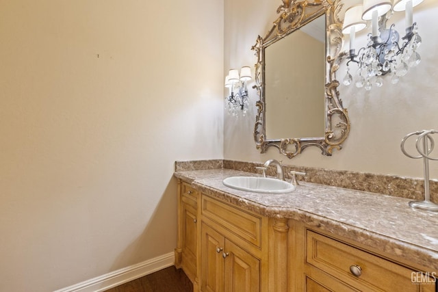 bathroom with vanity and hardwood / wood-style flooring