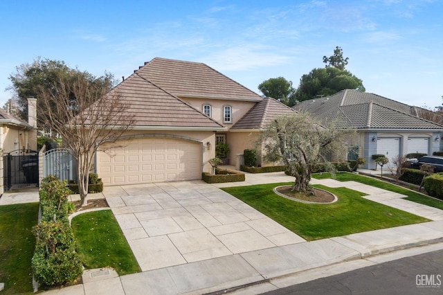 view of front facade with a garage and a front yard