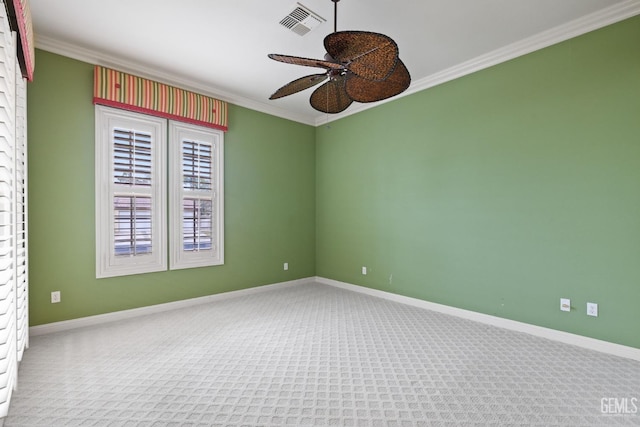 empty room with crown molding, carpet flooring, and ceiling fan