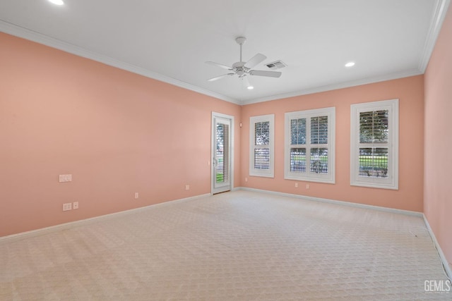 carpeted empty room with ornamental molding and ceiling fan