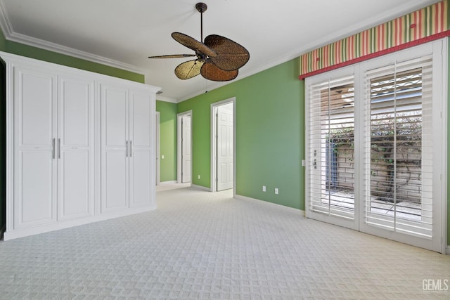 unfurnished bedroom with light colored carpet, access to outside, ornamental molding, and ceiling fan