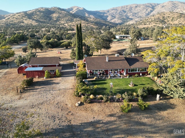 birds eye view of property with a mountain view