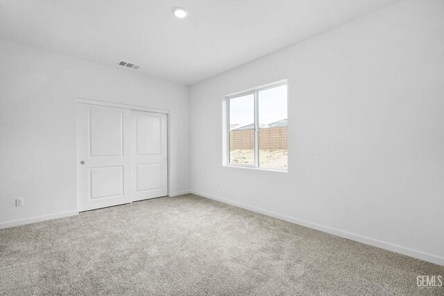 4912 Beaverhead Ave, Bakersfield, CA 93306 - unfurnished bedroom featuring carpet flooring, a closet, and recessed lighting