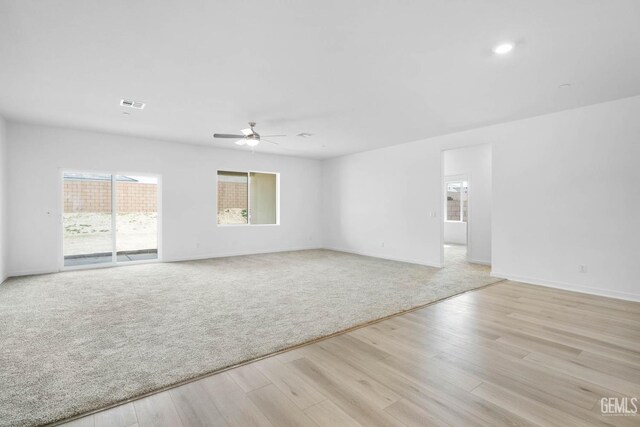 4912 Beaverhead Ave, Bakersfield, CA 93306 - unfurnished room with a ceiling fan, light wood-style floors, and light carpet