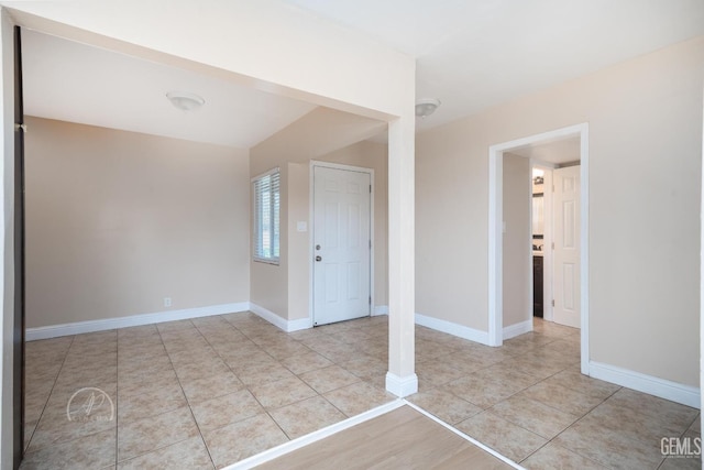 tiled spare room with baseboards