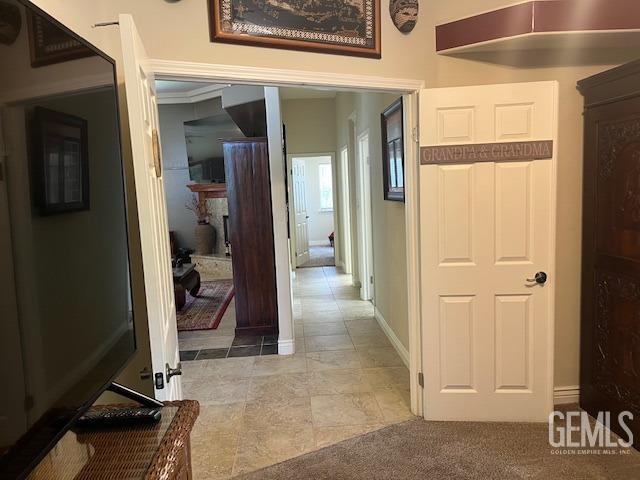 hall featuring baseboards
