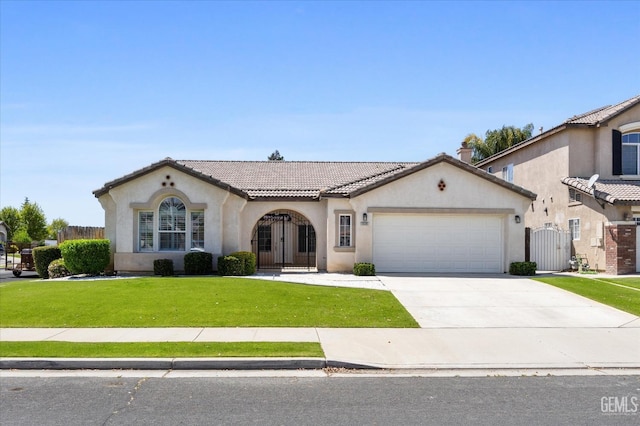 mediterranean / spanish house with stucco siding, a front yard, a tile roof, a gate, and a garage