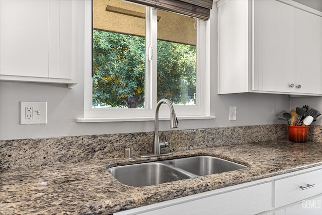 295 Walnut St, Shafter, CA 93263 - kitchen with a sink, white cabinets, and dark stone countertops