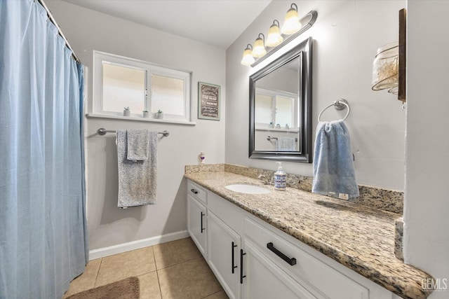 295 Walnut St, Shafter, CA 93263 - bathroom featuring vanity, baseboards, tile patterned flooring, and a shower with shower curtain