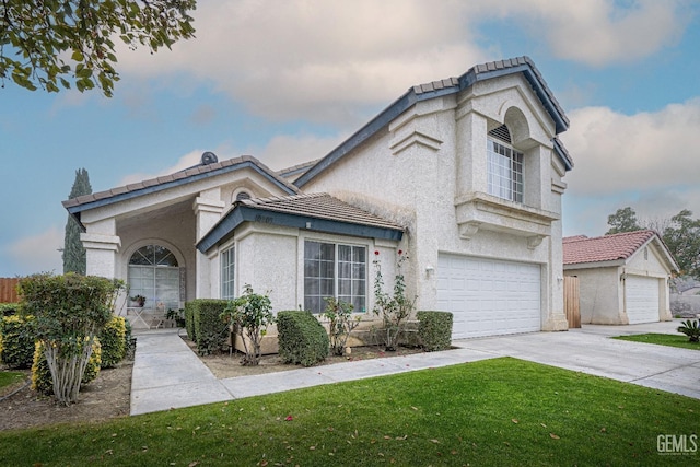 view of front of house with a garage and a front yard