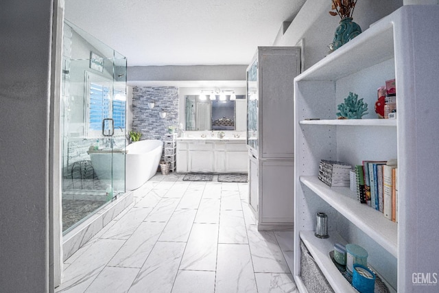 bathroom with vanity and separate shower and tub